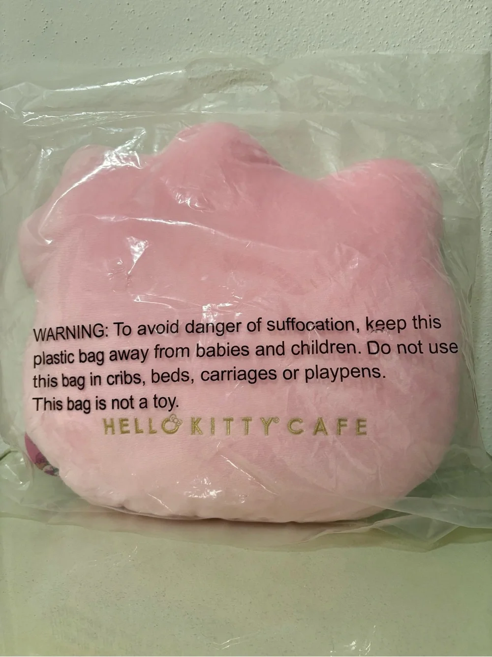 Hello Kitty Café Plush Face Cushion in Light Pink with Gold Logo